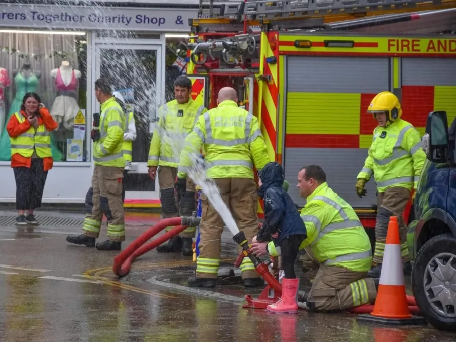 Firefighters hosing competitors during a previous Romsey Bed Race