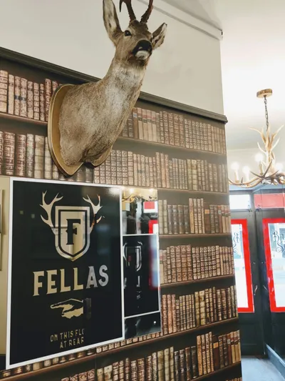 Interior view of Fellas, with a stag's head and Fellas sign