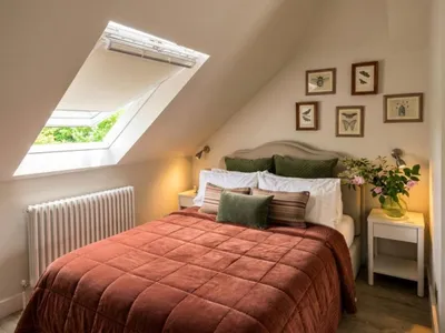 Double bed under a sloped ceiling