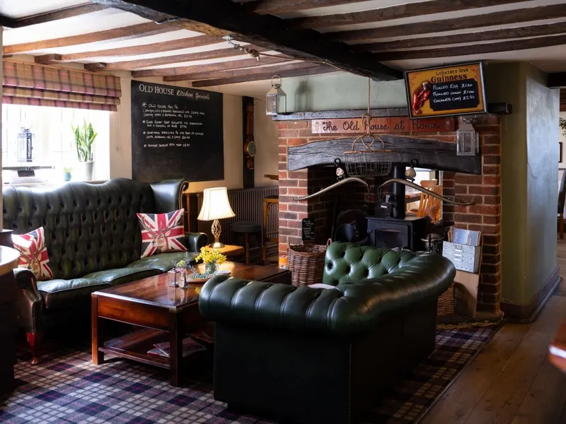 Interior seating with leather Chesterfields at The Old House at Home in Romsey