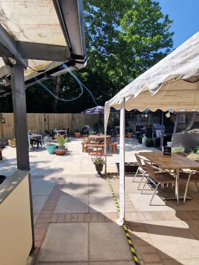 Beer garden seating at The Sun Inn in Romsey looking towards the railway